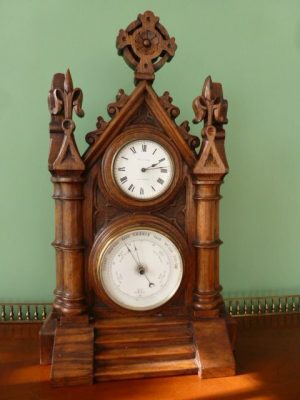 A Carved Walnut Combination Clock Barometer