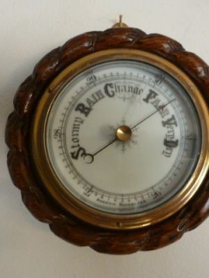 A Miniature Rope Edged Oak Cased Aneroid Barometer