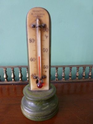 A Small Faux Marble Desk Thermometer