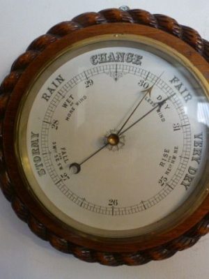 A Large Rope Edged Oak Cased Aneroid Barometer