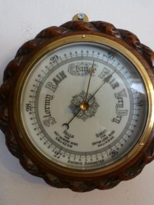 A Small Rope Edged Oak Cased Aneroid Barometer