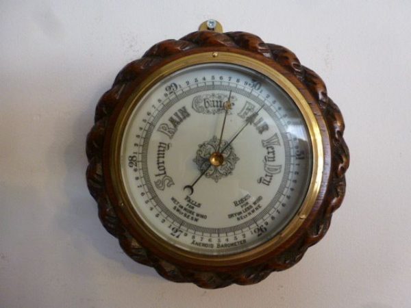 A Small Rope Edged Oak Cased Aneroid Barometer